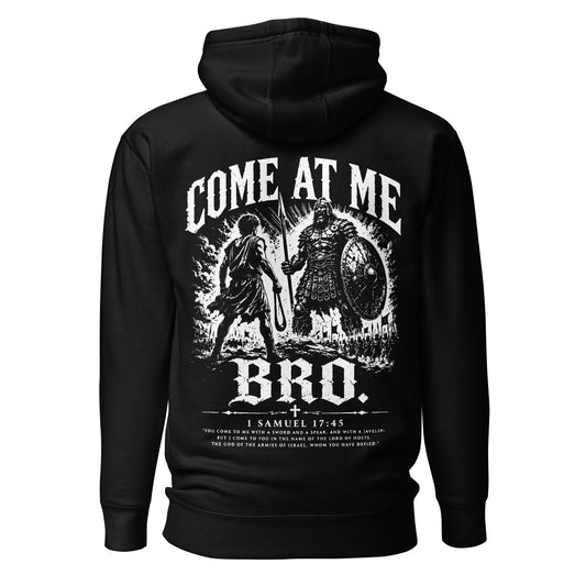 Product mockBlack Salty Saints Christian hoodie featuring dramatic distressed black-and-white artwork of young David confronting the giant Goliath with a sling, bold Come At Me Bro typography, and 1 Samuel 17:45 scripture beneath the design.up