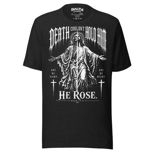 Black Christian T-shirt featuring a dramatic illustration of Jesus rising victorious over death with the words "Death Couldn't Hold Him – He Rose" inspired by Mark 16:6.